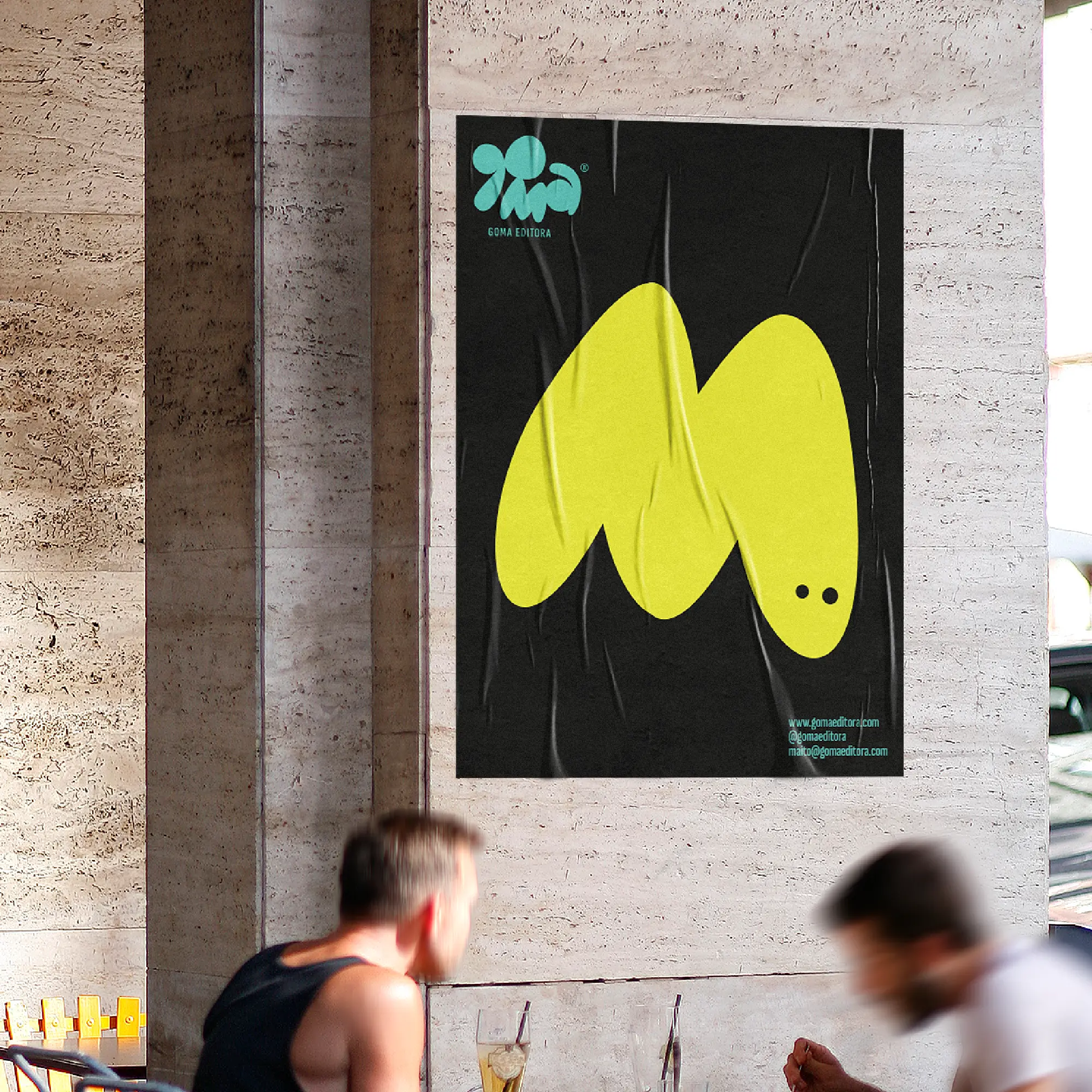 Black Goma poster with a large yellow abstract character in a street setting.