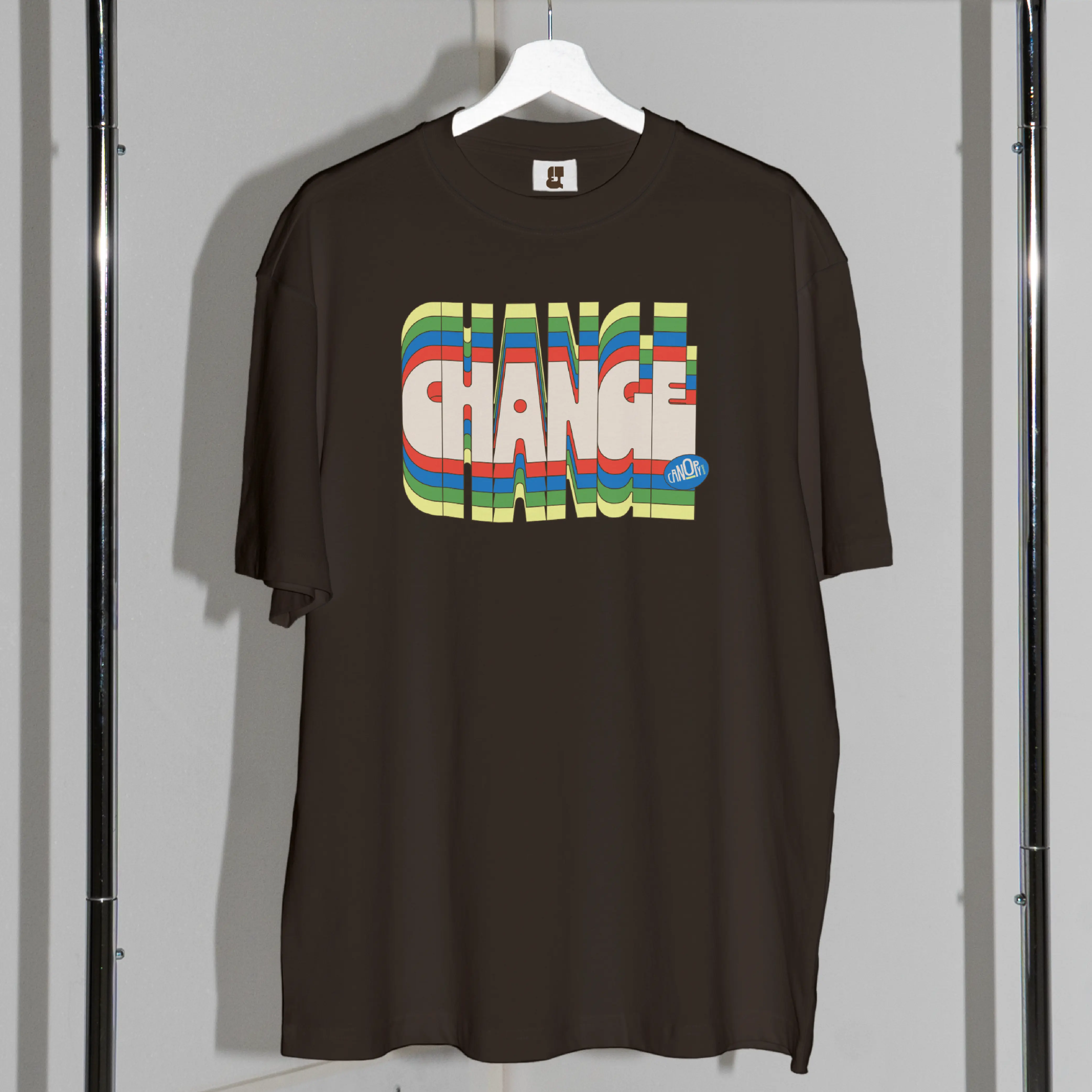 Black T-shirt printed with Change Climate Change in Zanco lettering.