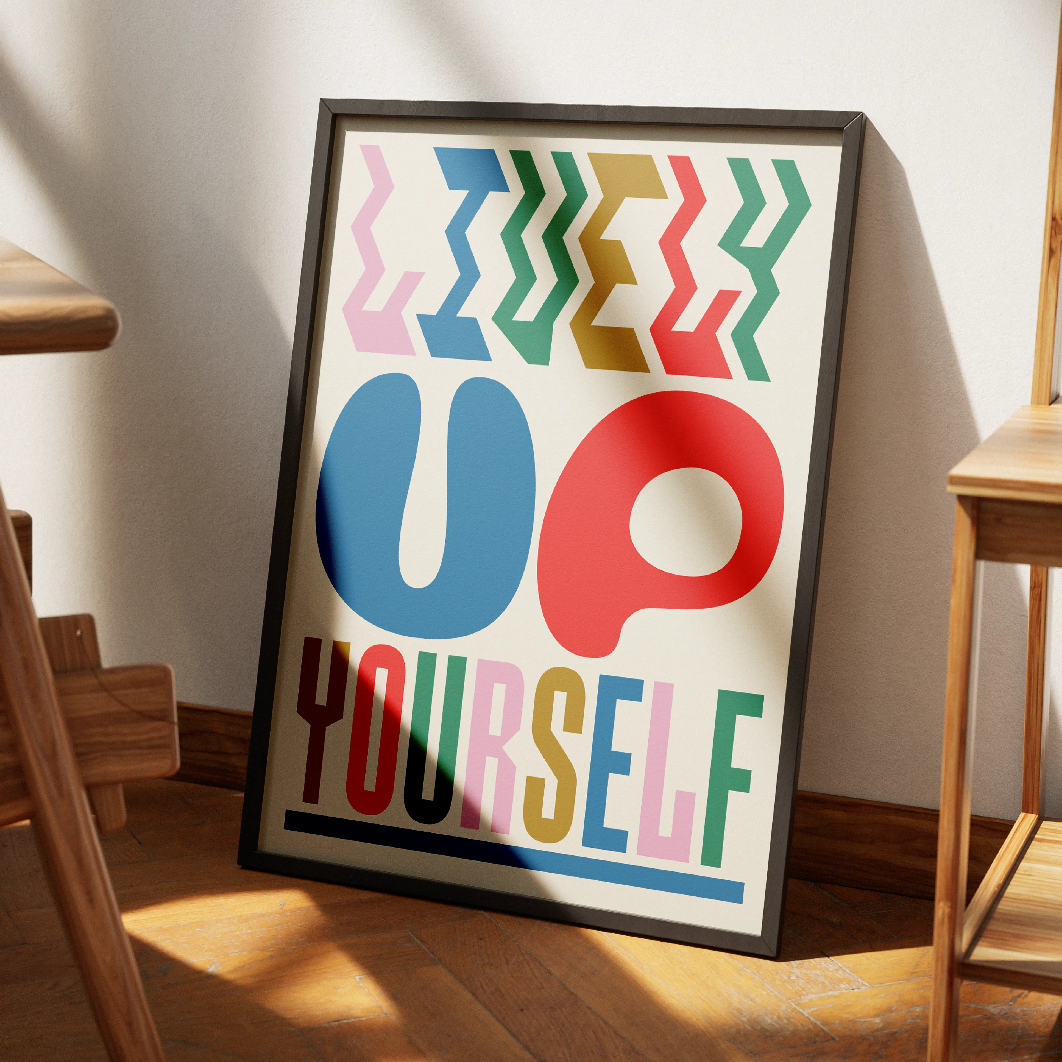 Framed Brinca poster reading Up Yourself with playful letters.