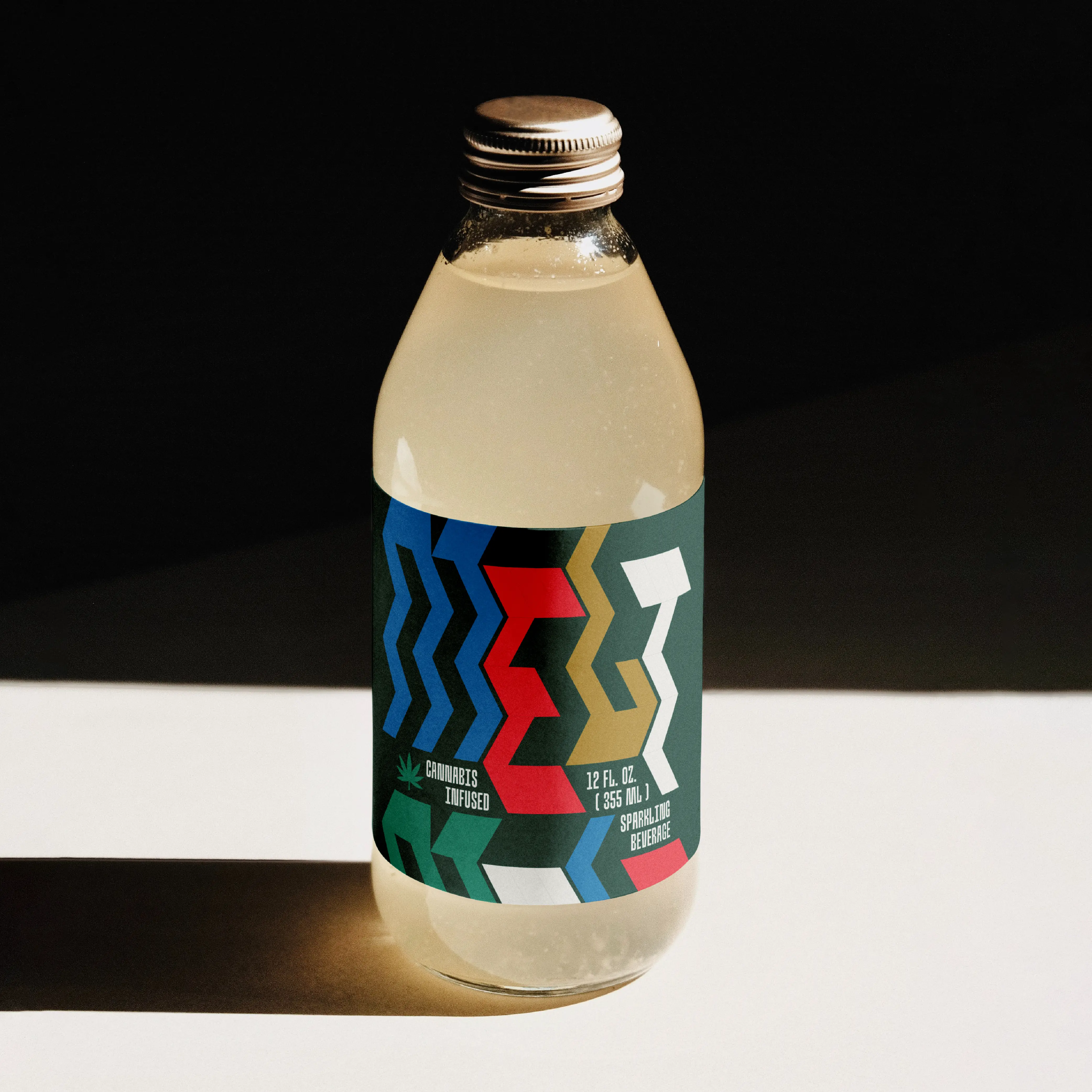 Beverage bottle label using Brinca zigzag typography.