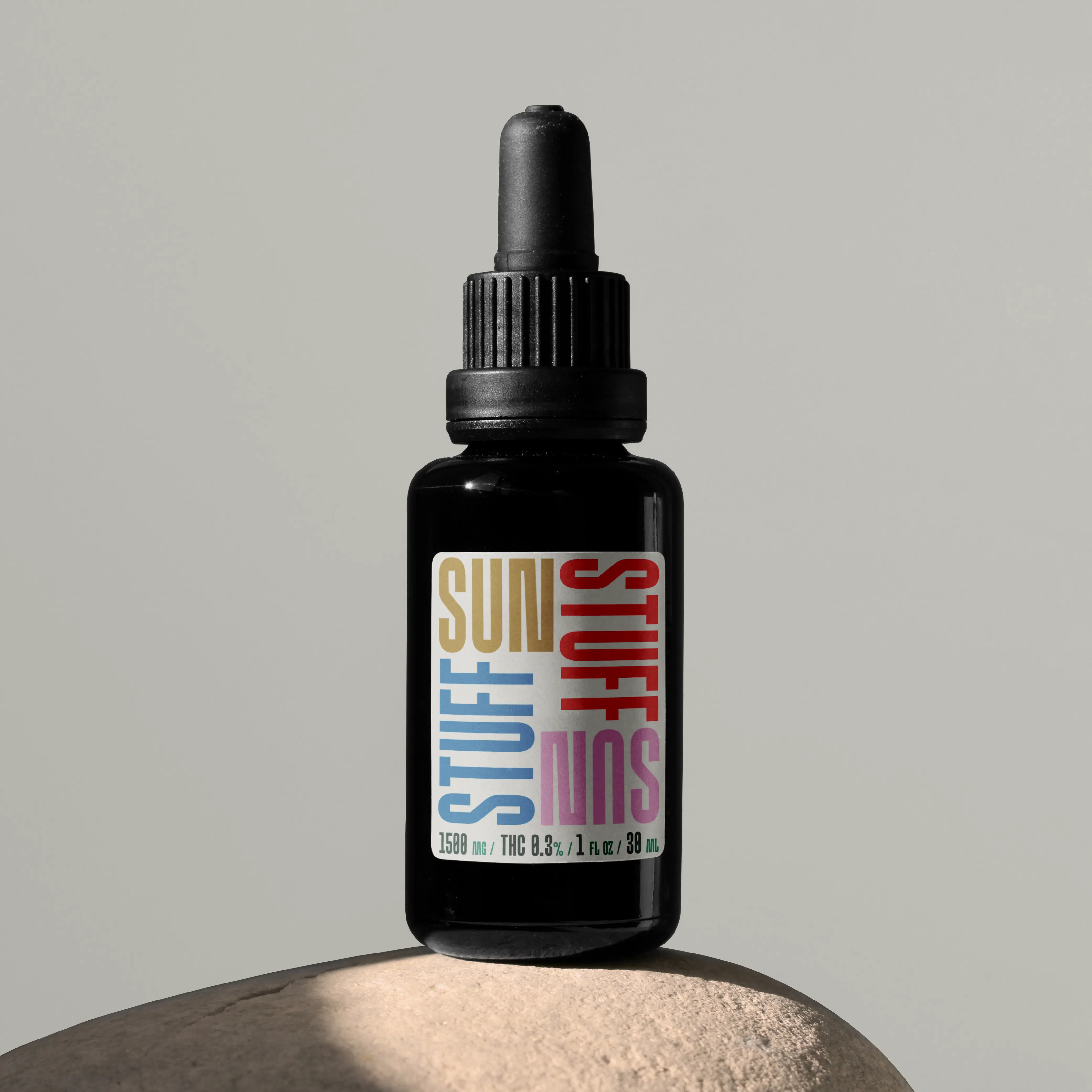 Dropper bottle label using condensed Brinca typography.