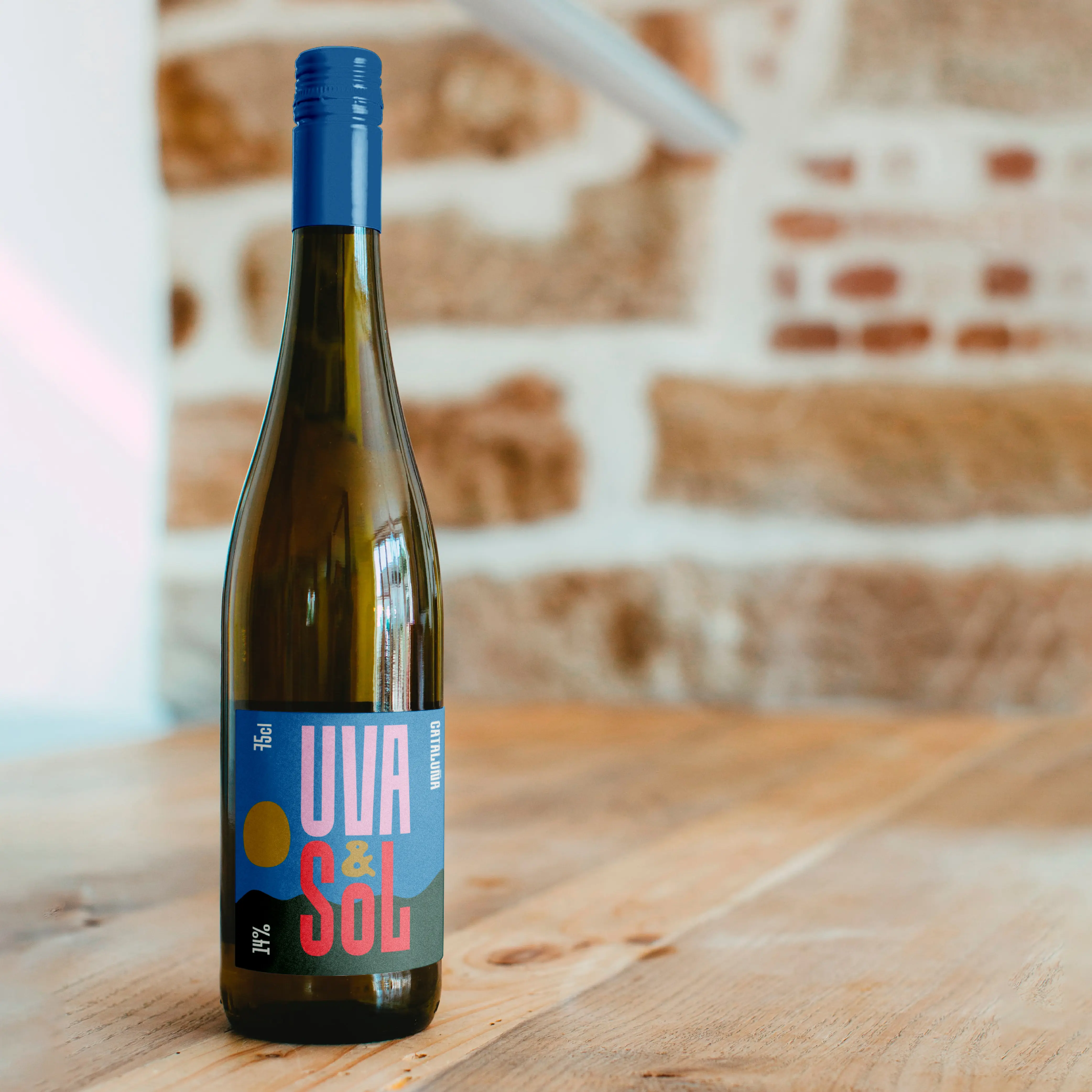 Wine bottle label with Brinca typography in blue and red.